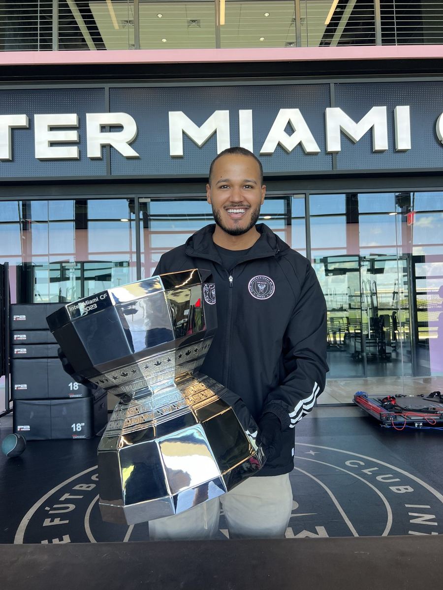 Carlos at the Inter Miami CF entrance with a trophy